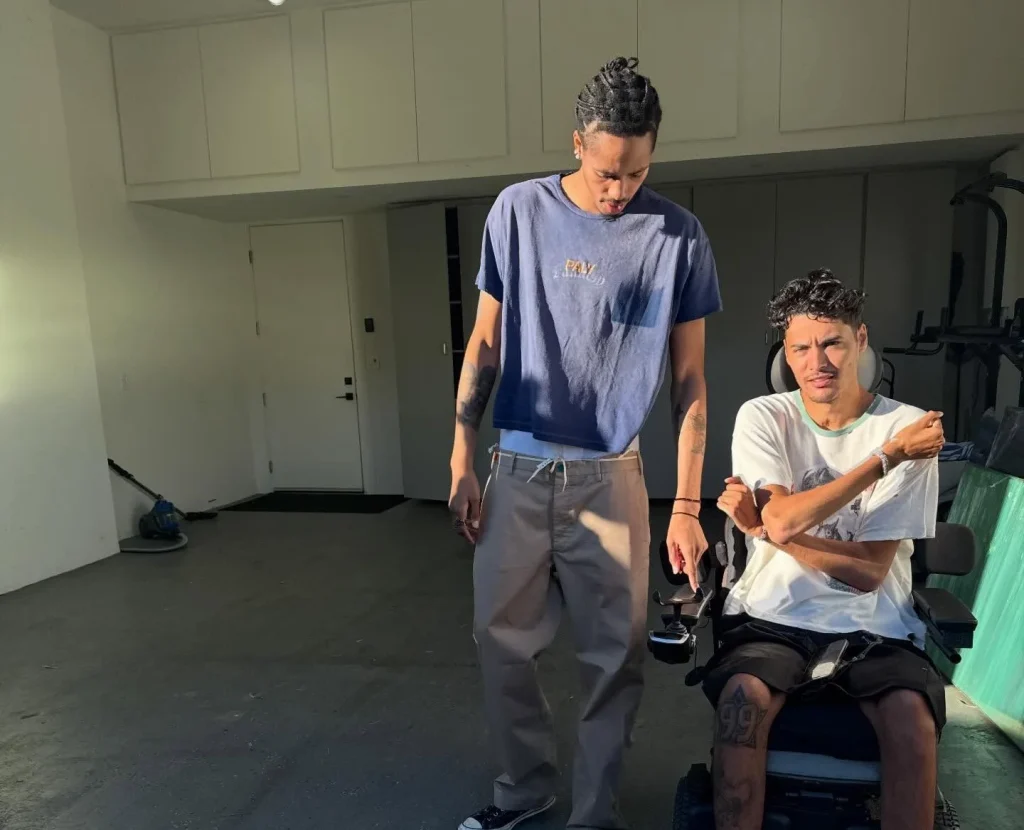Model left paralysed from chest down after diving into mislabelled shallow pool. Now 27, Isaac Lambert has gone viral sharing his story of survival and seven surgeries.
