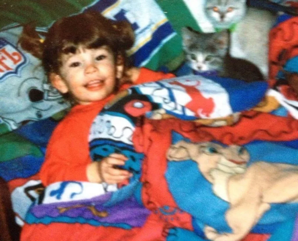 Woman reveals horrifying childhood in house with 70+ animals, suffering flea bites, filth and years of bullying. Now she advocates for children of hoarders.
