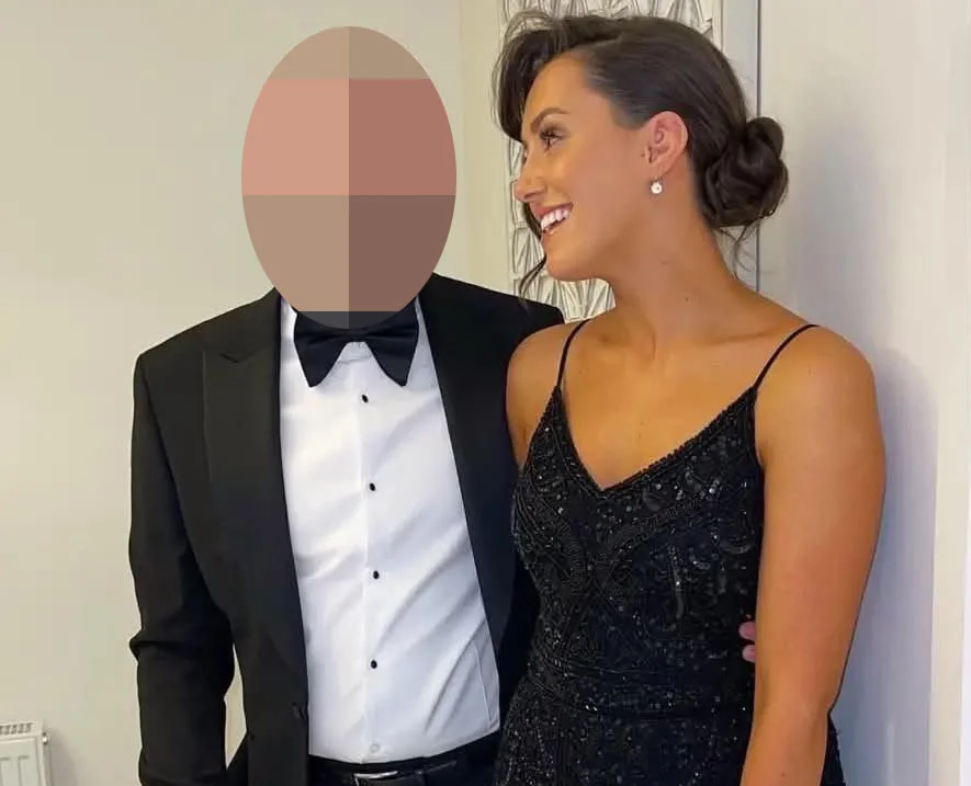 Woman in sparkly black dress next to man in tuxedo with pixelated face indoors