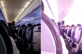 A passenger captured the terrifying moment their plane was struck by lightning mid-flight. Footage filmed from an aisle seat shows a blinding flash illuminating the.