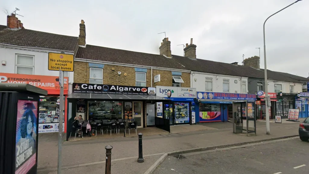 Masked thugs caught on CCTV setting fire to cafe in Peterborough at 1:54 am Monday. One attacker appears burned by flames. Footage goes viral.