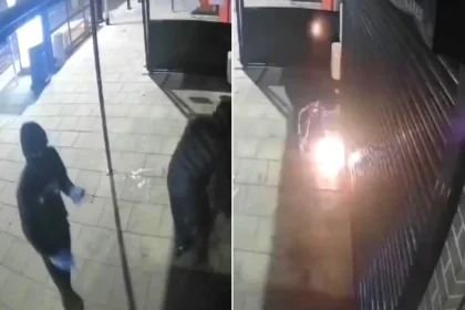 Masked thugs caught on CCTV setting fire to cafe in Peterborough at 1:54 am Monday. One attacker appears burned by flames. Footage goes viral.