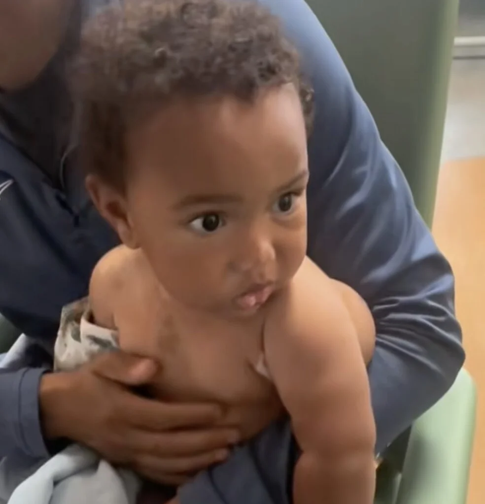 A mother has told of her worry as a huge tumour on her son's side grew so rapidly that it’s forcing his arm into the air.