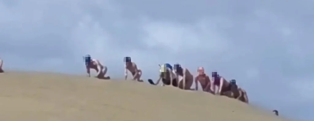 A “puppy parade” organiser faces a fine after kinksters were seen crawling across a protected sand dune. Legal proceedings have been issued against a kinky community.