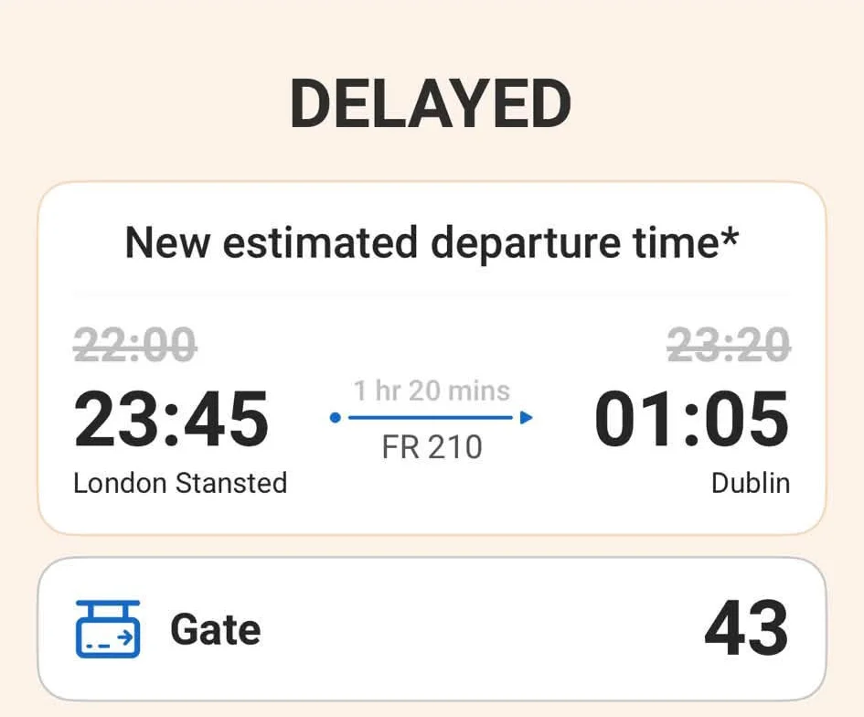 Ryanair app showing delayed flight FR210 from London Stansted to Dublin with new departure time 23:45.