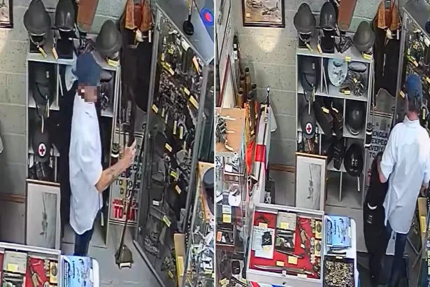 Thief caught on CCTV stealing replica rifle from antique shop by hiding it under his jacket. The weapon was not real but used by historical re-enactors near Birmingham.