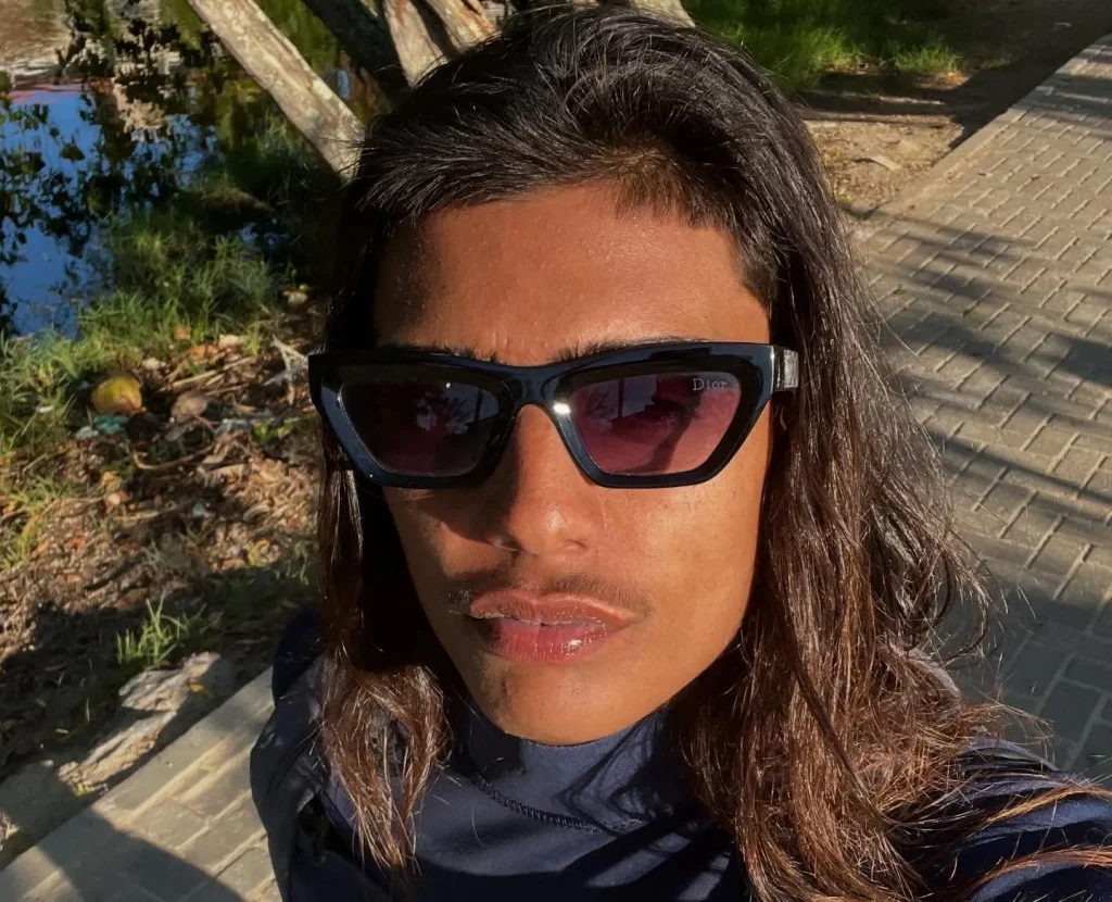 Teenage surf champion Rickson Falcão survives being shot four times in a drive-by shooting at a snack bar in Brazil. One person was killed in the attack.