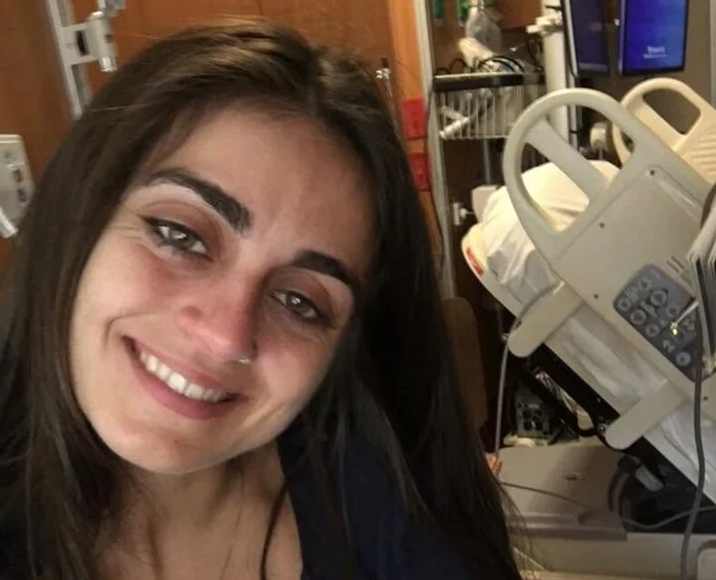 A tourist plunged hundreds of metres to her death after reportedly stepping away from a mountain path to take a photograph.