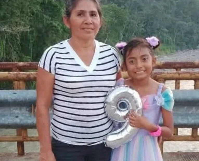 Vengeful locals have lynched a suspected killer accused of murdering a grandmother and her granddaughter. A second suspect was rescued alive after also being attacked.