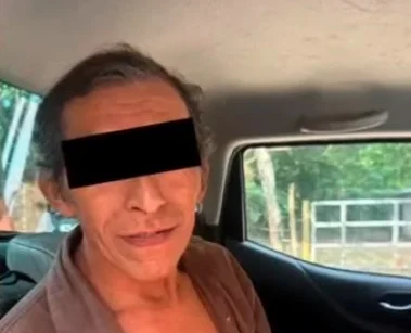 Vengeful locals have lynched a suspected killer accused of murdering a grandmother and her granddaughter. A second suspect was rescued alive after also being attacked.