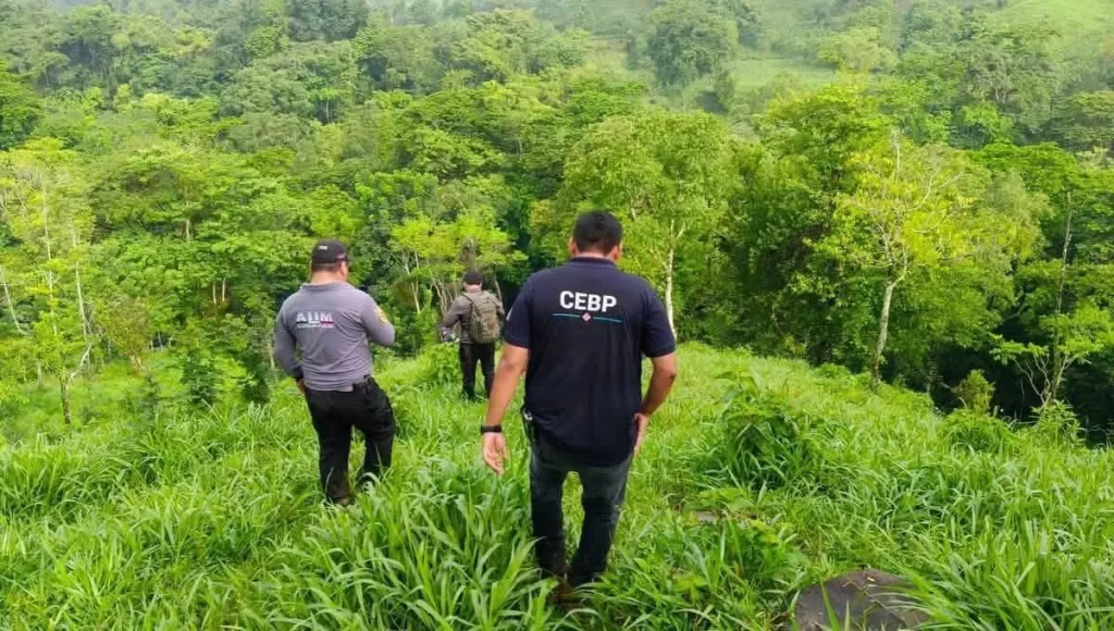 Vengeful locals have lynched a suspected killer accused of murdering a grandmother and her granddaughter. A second suspect was rescued alive after also being attacked.